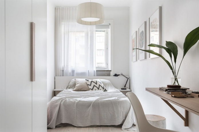 Narrow bedroom with a bed by the window