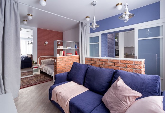 zoning with curtains in the interior of the bedroom-living room