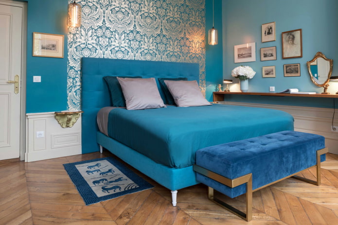 textiles and decor in a turquoise bedroom
