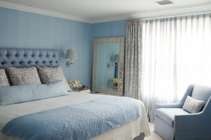 textiles and decor in the interior of a blue bedroom