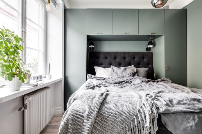 wardrobe at the head of the bed