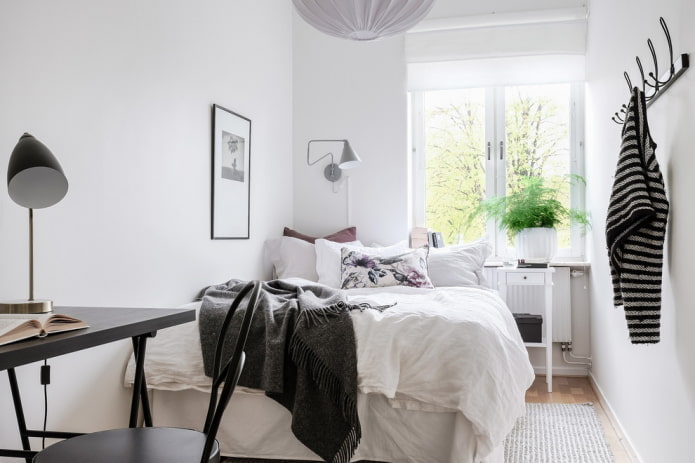 white walls in a small bedroom