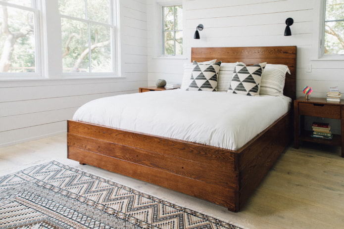 wooden bed in the bedroom