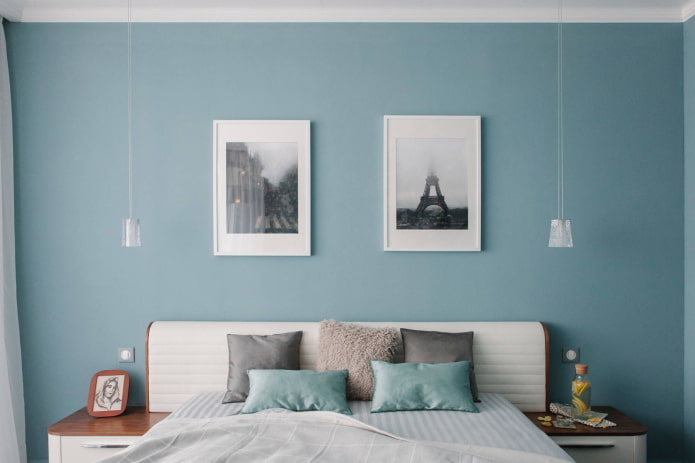 paintings above the bed