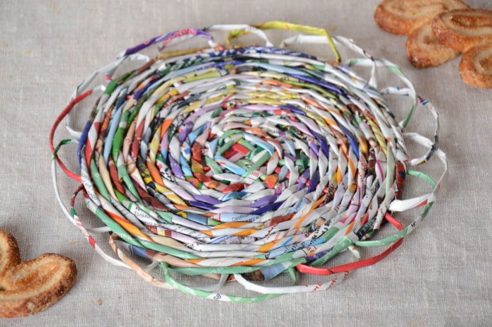 wicker stand made of magazine tubes