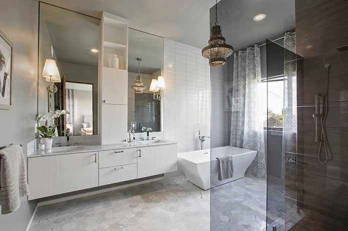 part of the wall in the bathroom is tiled with mirror tiles