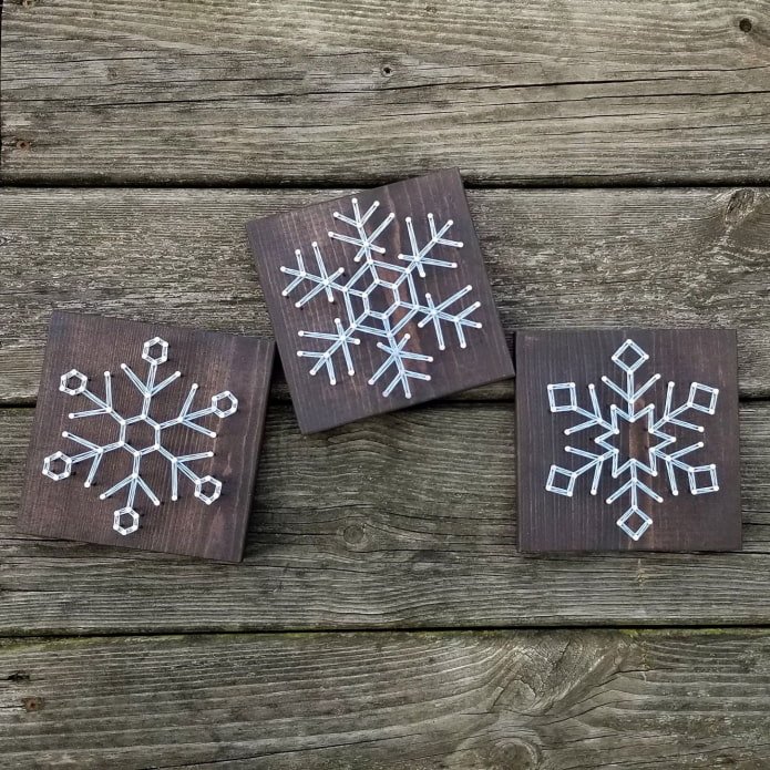 snowflakes made of nails and threads