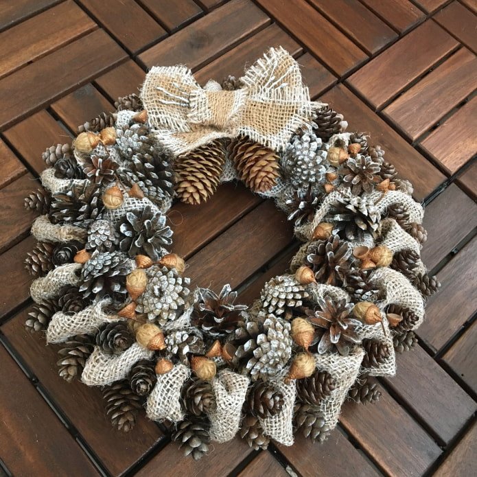 Christmas wreath made of burlap and pine cones