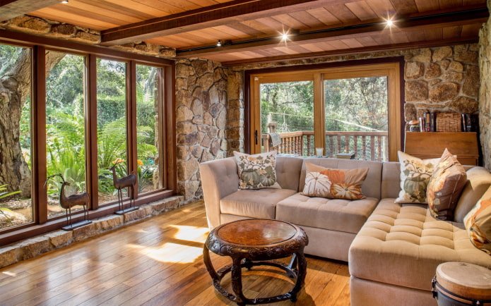 finishing walls in a wooden house with decorative stone