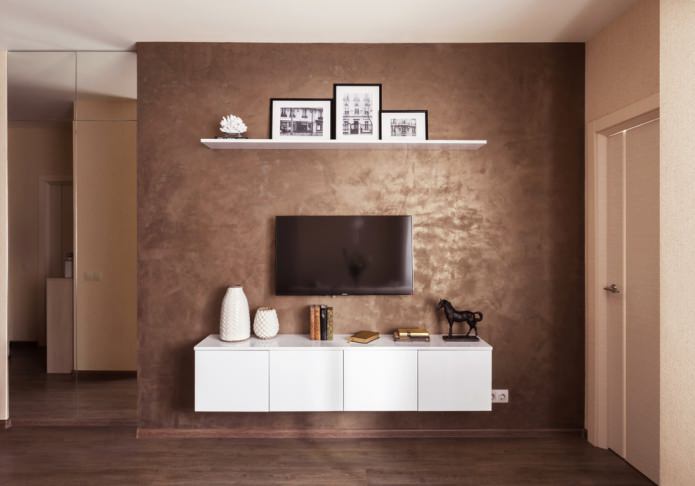 brown plaster on the wall by the TV