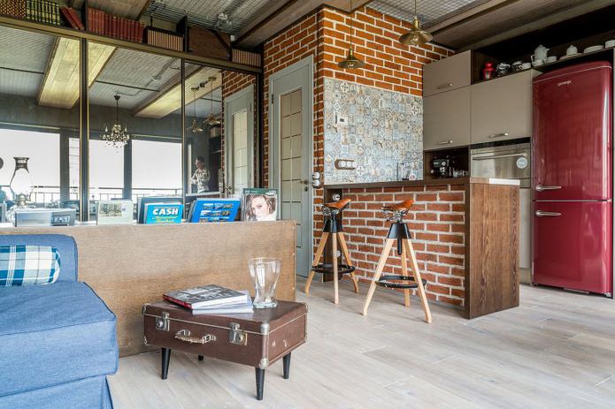 Interior of a small loft-style apartment of 33 sq. m.