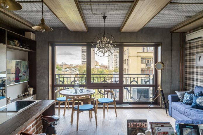 Interior of a small loft-style apartment of 33 sq. m.