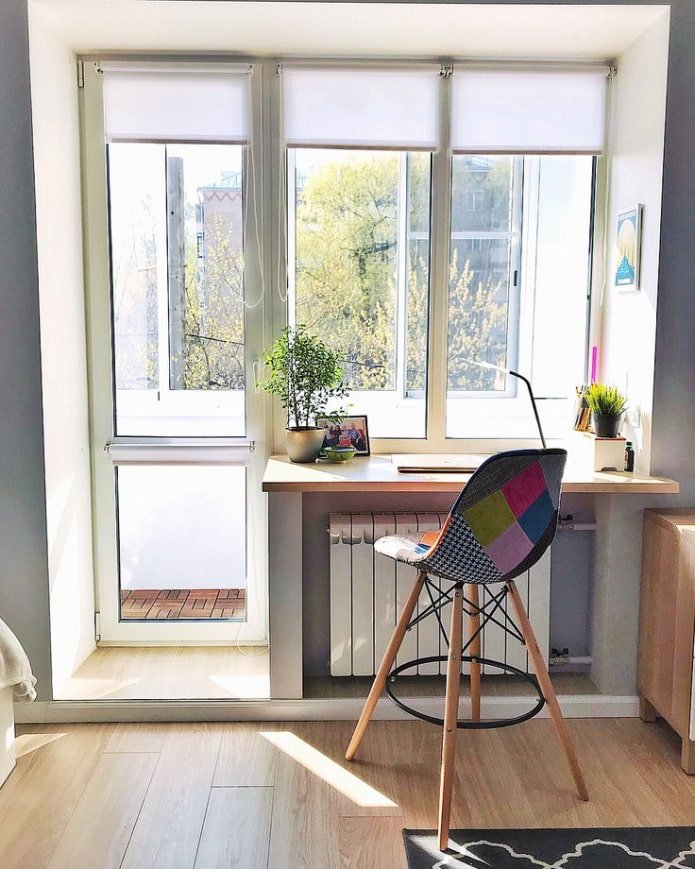window sill turning into a table with a wooden tabletop