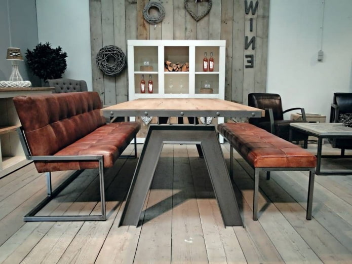 table with iron legs in the interior in loft style