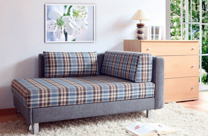 ottoman with checkered upholstery in the interior