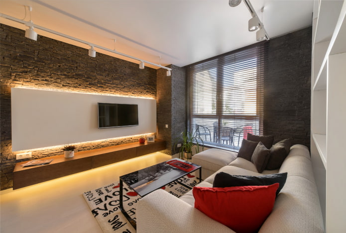 TV on the wall with lighting in the hall