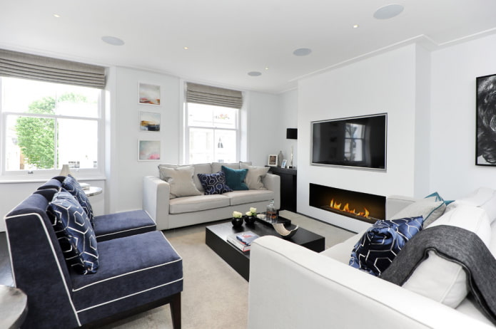 TV on the wall with a fireplace in the interior of the hall