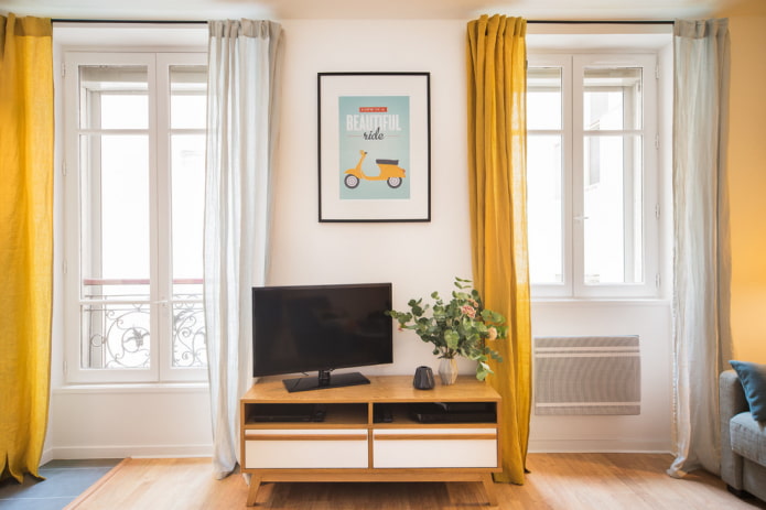 TV by the window in the living room interior