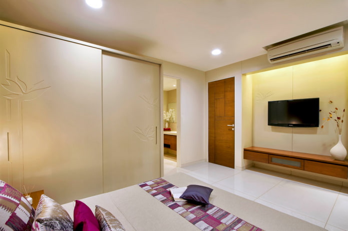 TV in a niche in the bedroom interior