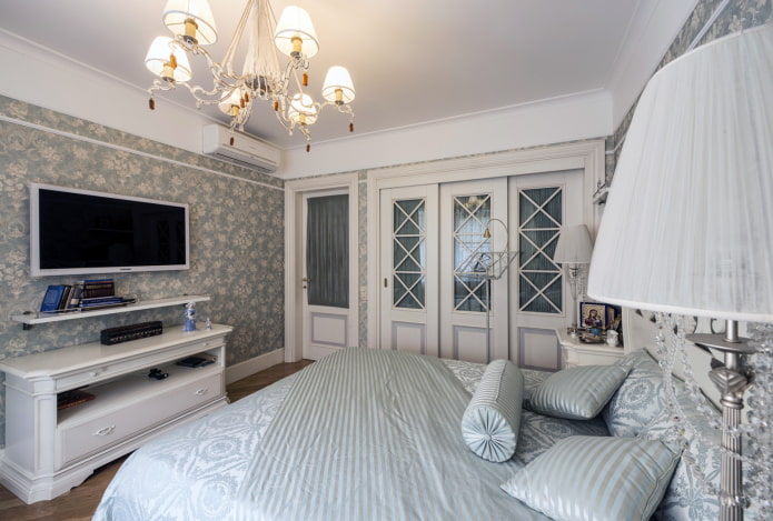 TV in the interior of the bedroom in the Provence style