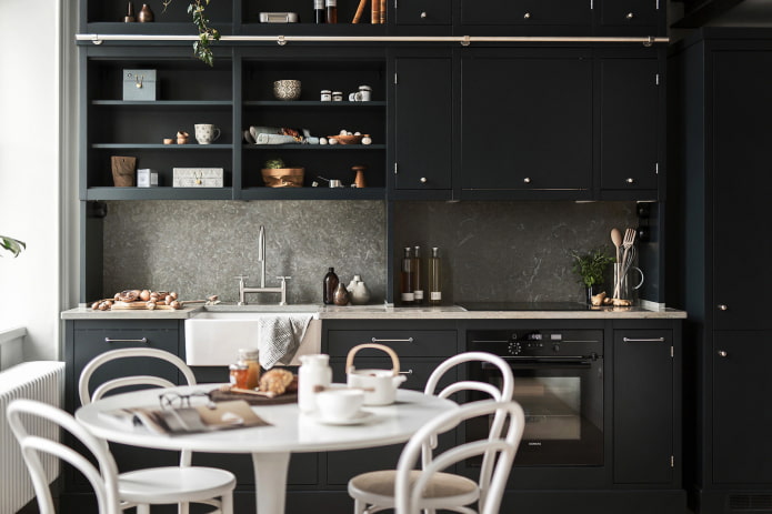 Dark kitchen with a white table