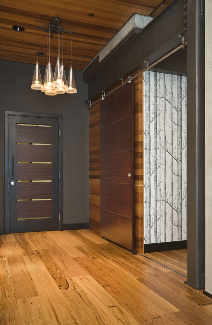 gray walls with a wooden ceiling and floor