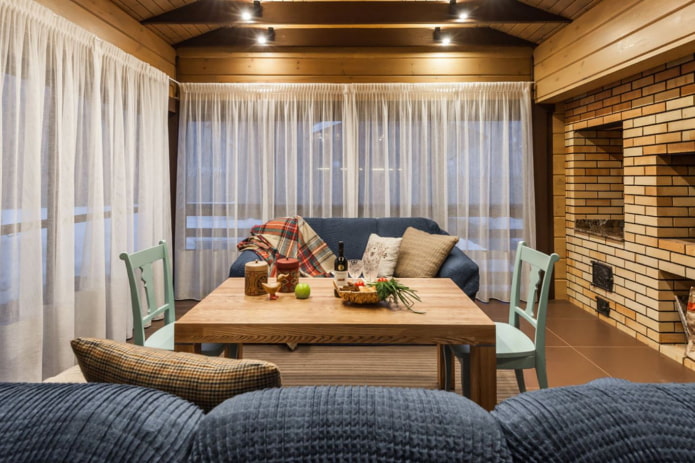 the barbecue area on the terrace is closed with curtains