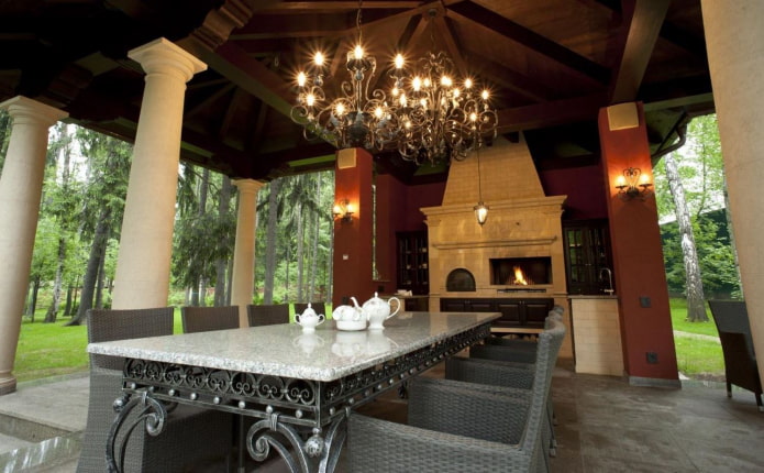 wrought iron chandeliers and a table on the terrace