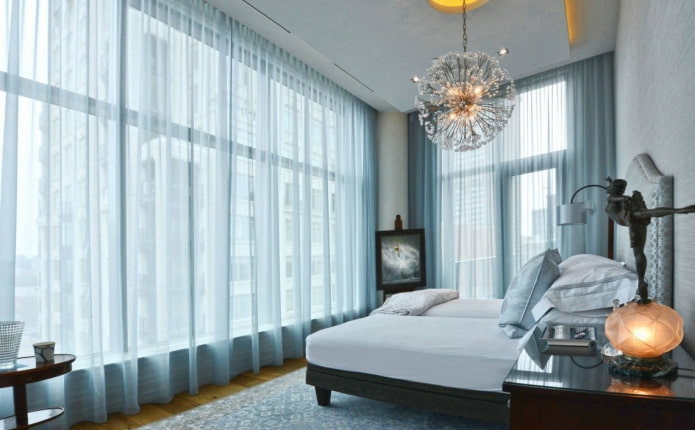 blue curtains in the bedroom interior