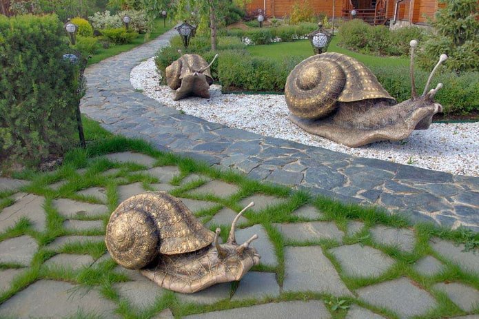 snail sculptures in landscape design