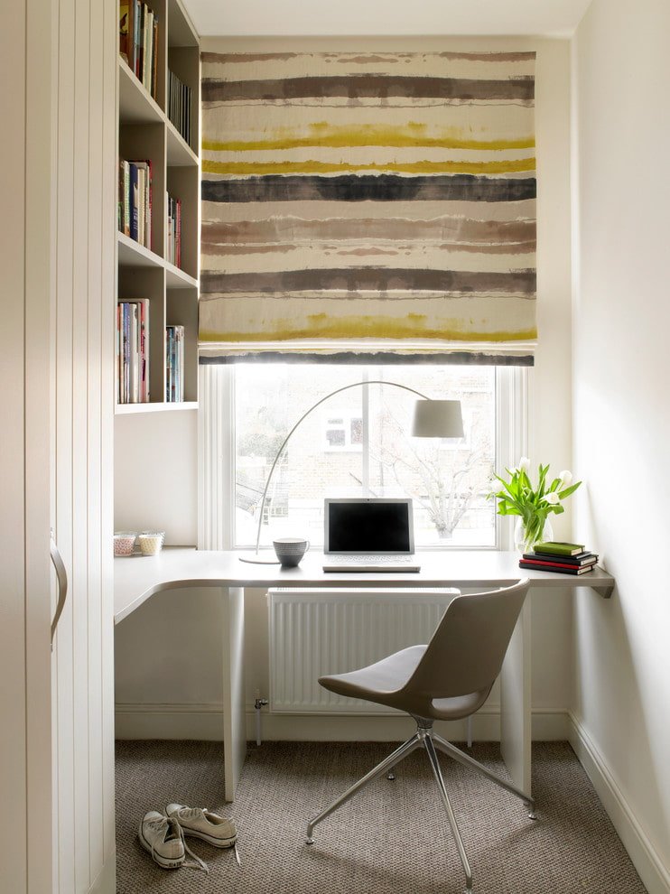 white table at an angle by the window