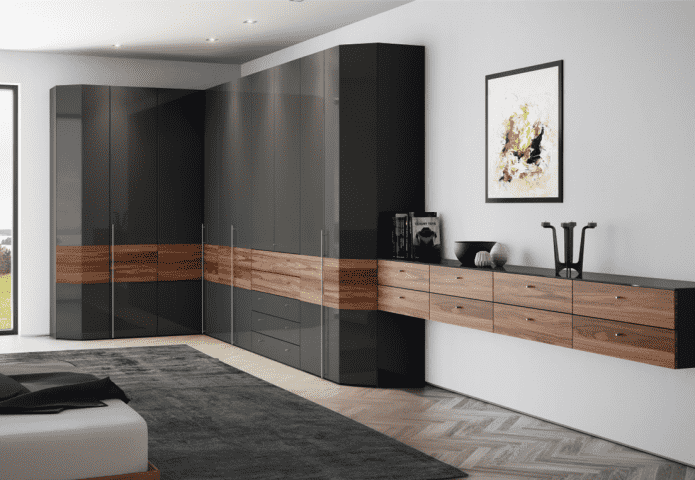 corner wardrobe in the interior of the hall in a modern style