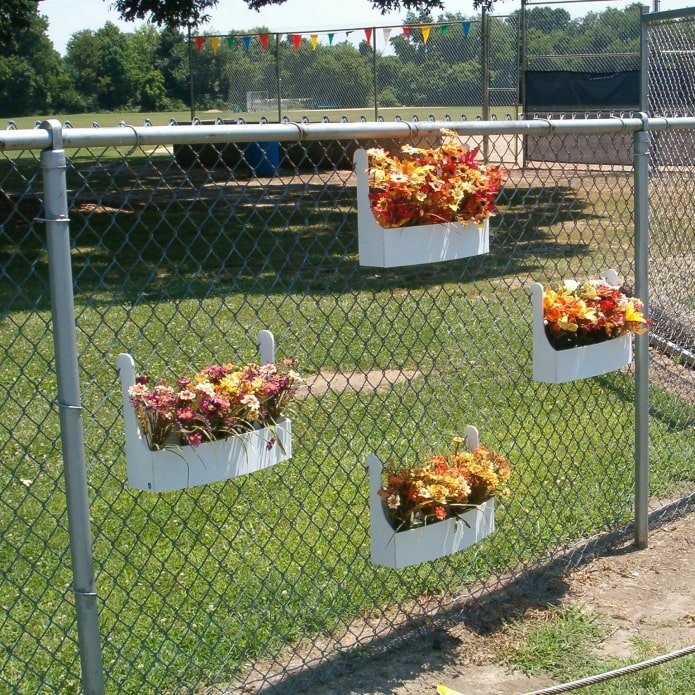 flower boxes on a chain-link fence