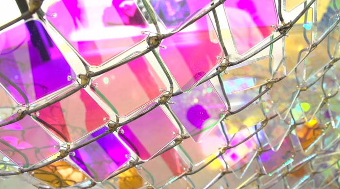 colored glass on a chain-link fence