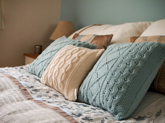 knitted pillows on the bed