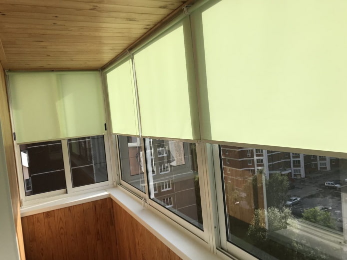 roller blinds on a balcony with sliding windows