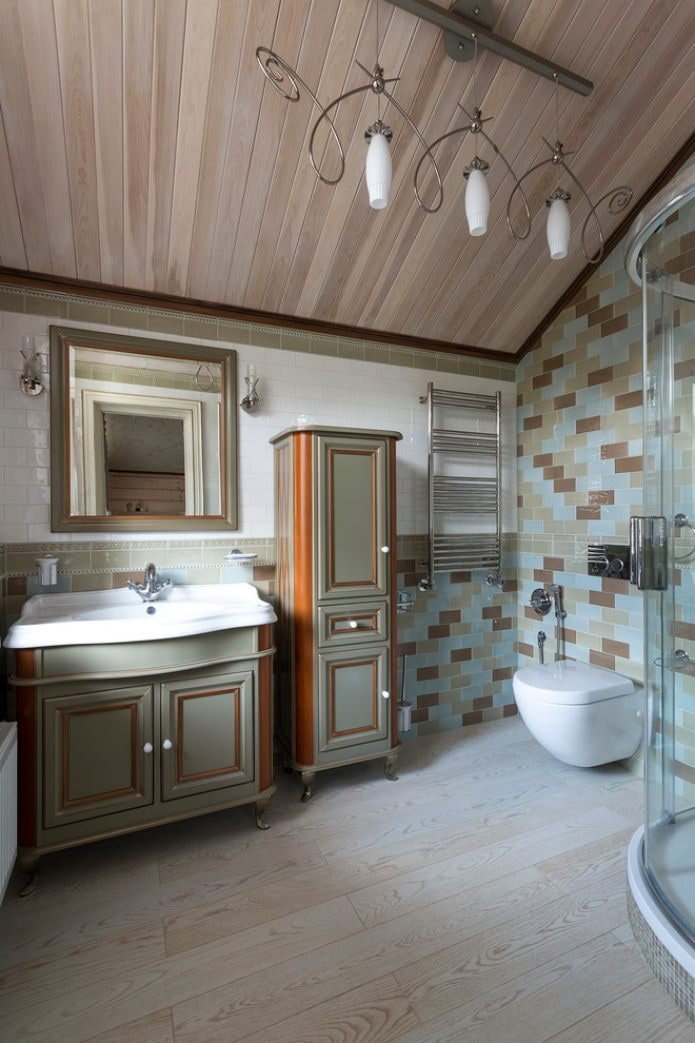 sconces and chandelier in the bathroom