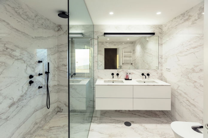 a combination of marble with black plumbing