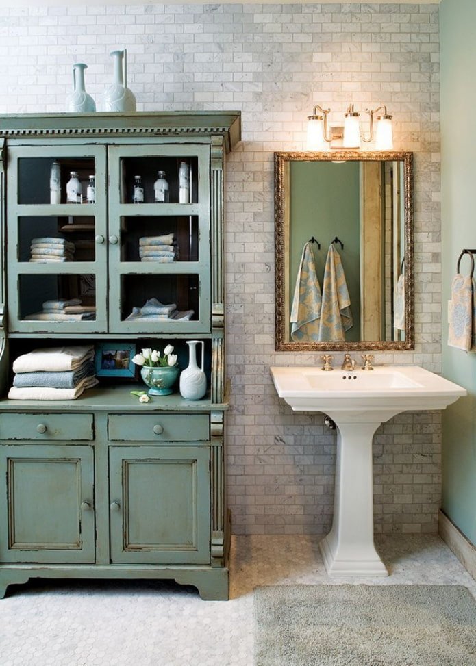 Bathroom with an antique chest of drawers