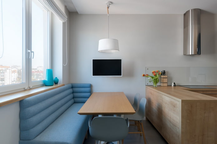 TV above the table in the kitchen