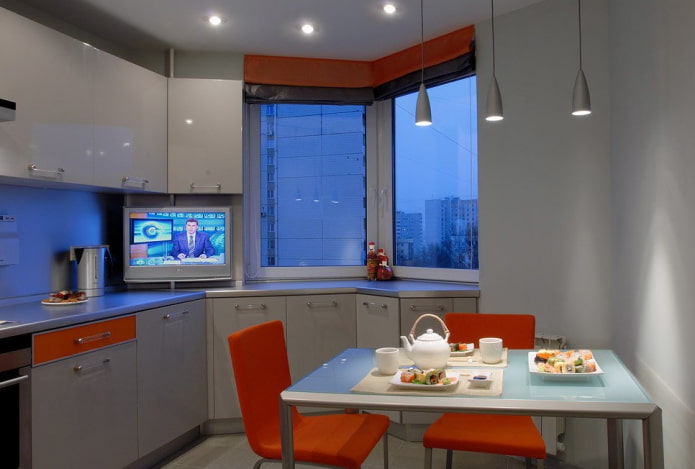 TV on the window sill in the kitchen
