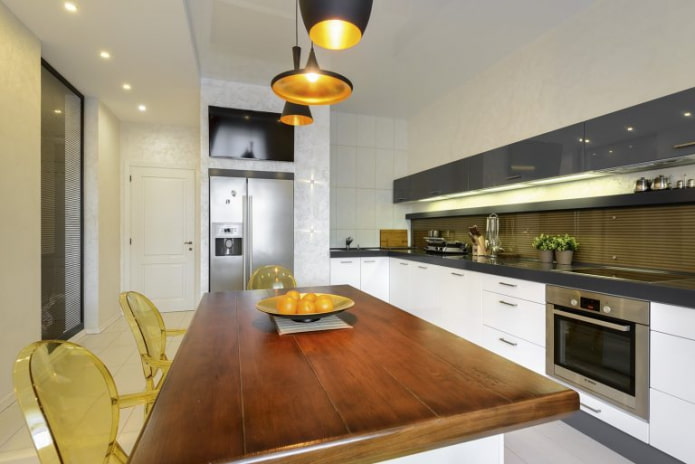 TV above the refrigerator in the kitchen