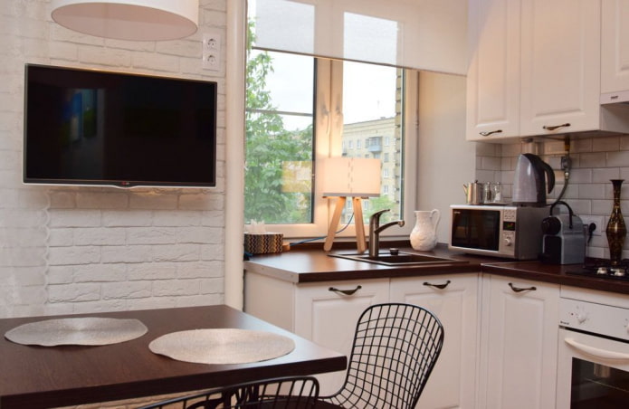 TV in the interior of a small kitchen
