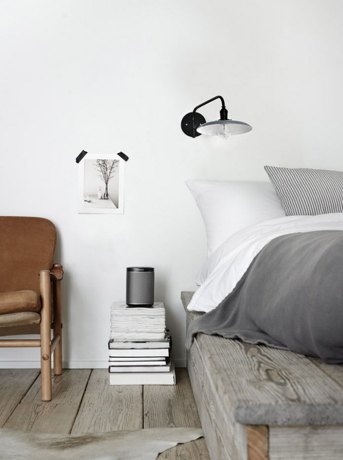 a stack of books as a nightstand