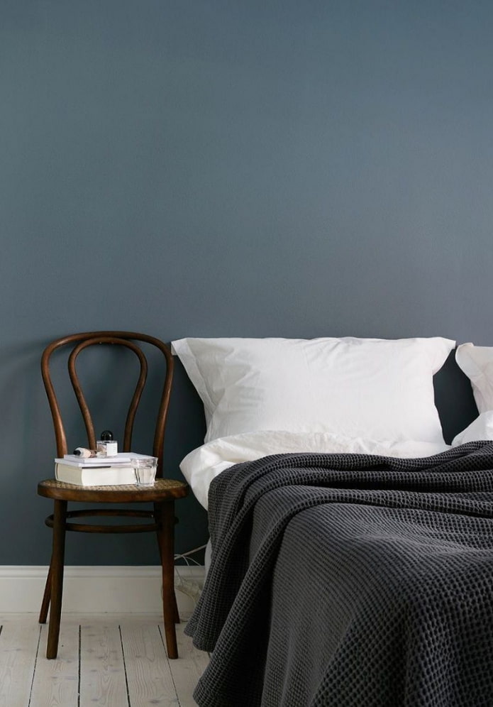 wooden chair near the bed