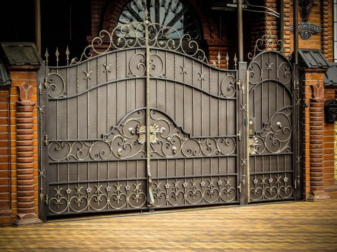 forged gates with a wicket