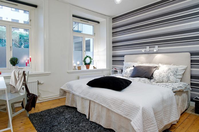 bedroom with an accent striped wall