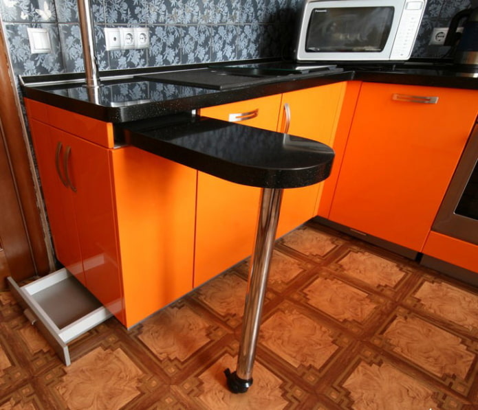 pull-out tabletop built into the bar counter