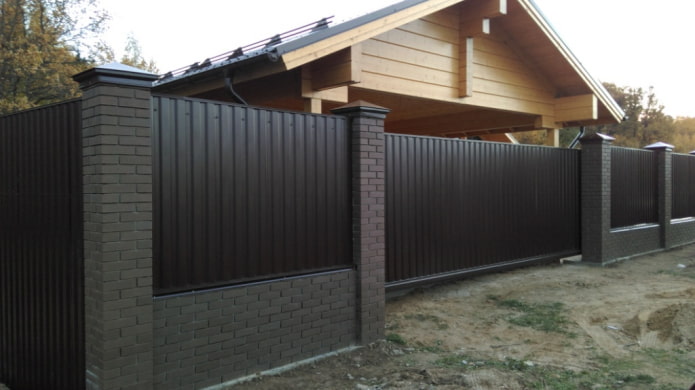 Black fence made of profiled sheet