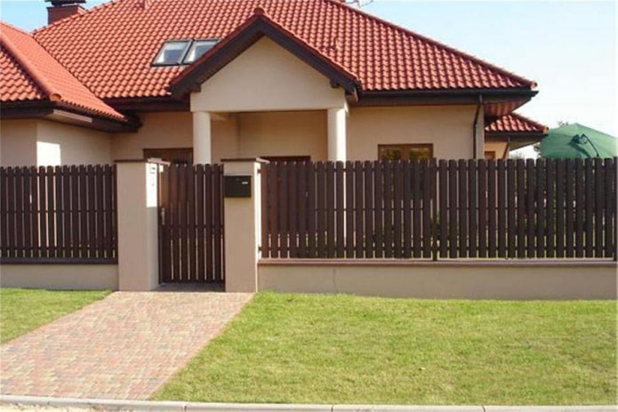 Fence made of metal planks for the house